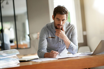 Wall Mural - Modern man working in office