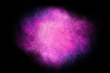 Wall Mural - freeze motion of colored dust explosion isolated on black background.