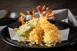 The tempura shrimps with sauce, deep-fried shrimps in the traditional Japanese restaurant.