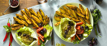 Banner Of Whole Plant Vegan Lunch Or Dinner Of Baked Potatoes, Baba Ganoush, Tomato And Avocado Salad. Modern Healthy Food. Shot From Above.