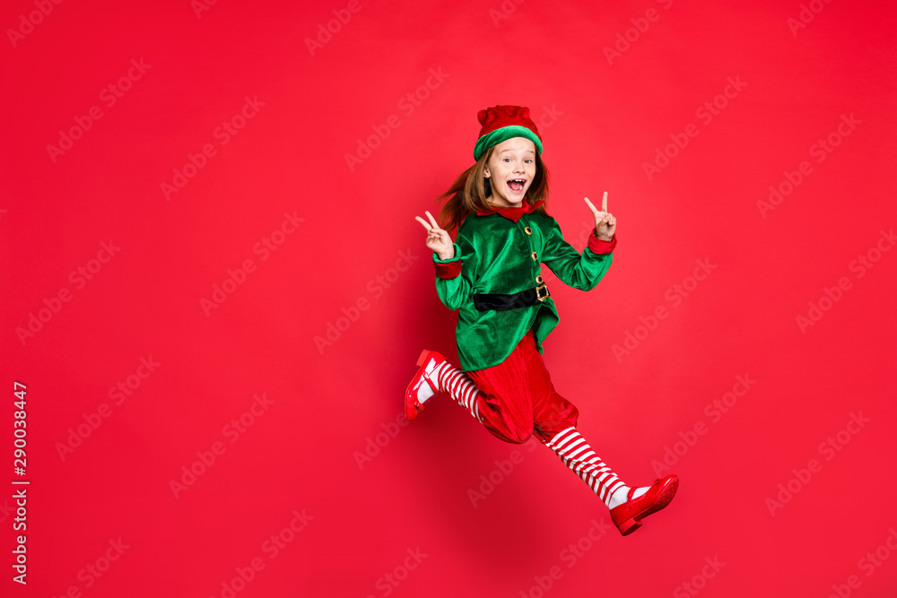 Full length body size view of nice attractive cheerful cheery glad optimistic funny funky overjoyed small little pre-teen elf having fun showing v-sign isolated over bright vivid shine red background - obrazy, fototapety, plakaty 