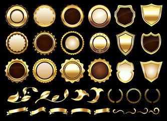 Wall Mural - Elegant golden labels. Shields badges, gold ornamental scrolls amd retro label. Royal award insignia, luxury gold ribbon. Isolated vector illustration icons set