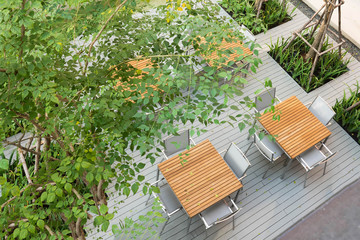 Wall Mural - The top view of wooden tables and chairs