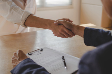 Wall Mural - Partnership. two business people shaking hand after business signing contract in meeting room at company office, job interview, investor, success, negotiation, partnership, teamwork, financial concept