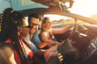 © Zoran Zeremski - Three best friends enjoying traveling at vacation in the car.