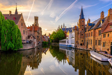 Classic View Of The Historic City Center Of Bruges (Brugge), West Flanders Province, Belgium. Sunset Cityscape Of Bruges. Canals Of Brugge