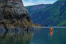 Single Kayaker In Orange Kayak With Starfish, Sadie Cove, Alaska