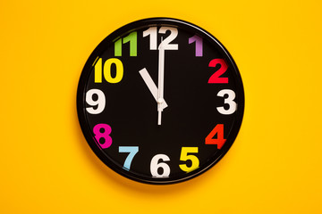 Wall Mural - colorful wall clock show eleven o'clock