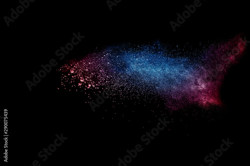 Abstract colorful dust particles textured background.Multicolored powder expl...