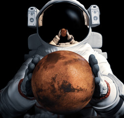 Wall Mural - astronaut holds the planet mars in his hands