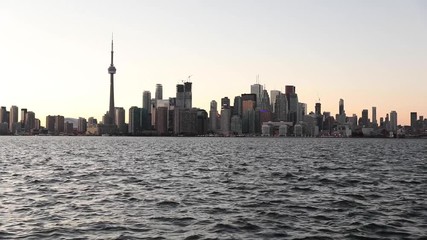 Wall Mural - Toronto skyline view at sunset across Lake Ontario