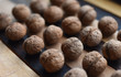 © orlovphoto - walnuts lie in straight rows on a striped background