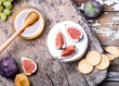 © nataliiaGL - Homemade cookies, soft cheese and fruits on a wooden board.