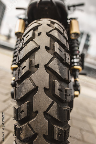 Fotomural Rear view of motorcycle wheel with tire tread closeup