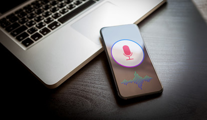 Wall Mural - speech recognition concept - close-up mobile phone with microphone icon and wave sound symbol. perso