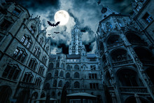 Scary Dark Castle With Moon And Bats. Fantasy Horror For Halloween Theme. Marienplatz At Night, Munich, Germany. 