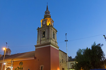 Wall Mural - night image of the church of San Francisco, Catholic temple and old convent, in the Alameda, the main avenue of Santiago de Chile