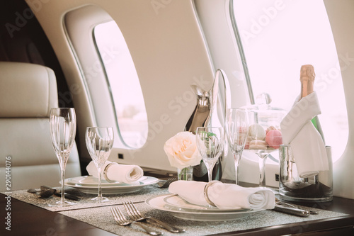 Fotografía modern and comfortable interior of business jet aircraft with decor