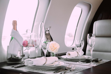 modern and comfortable interior of business jet aircraft with decor