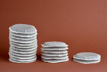 Stack Of Coffee Pods On A Brown Background