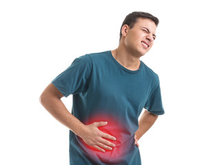 Young man suffering from abdominal pain on white background