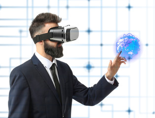 Wall Mural - Businessman wearing virtual reality glasses on white background