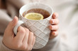 © Pixel-Shot - Beautiful young woman with cup of hot tea, closeup