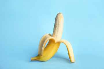 Wall Mural - Fresh banana on light blue background. Sex concept