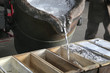 Molten metal is poured into molds at a factory