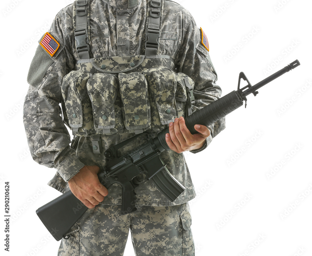 Soldier with assault rifle on white background