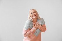 Happy Mature Woman On Grey Background