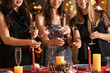 © Pixel-Shot - Happy women with Christmas sparklers and glasses of champagne at party
