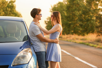 Poster - Happy couple near their new car in countryside