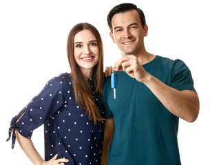 Poster - Happy couple with key from their new car on white background