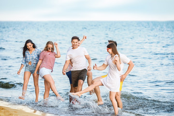 Poster - Happy friends on sea beach at resort