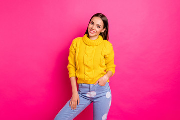 Poster - Portrait of lovely girl looking smiling wearing knitted pullover isolated over pink background