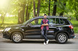 © F8  \ Suport Ukraine - Young handsome indian man standing near his car on the road