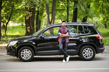 Young Handsome Indian Man Standing Near His Car On The Road