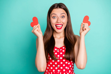 Sticker - Portrait of cheerful girl screaming wow omg holding papecard wearing stylish trendy polka dot dress skirt isolated over teal turquoise background