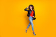 © deagreez - Full length photo of cheerful girl have stroll fun with her friends on spring free time wear good modern look denim jeans isolated over yellow color background