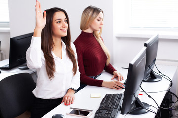 Wall Mural - Two female colleagues in office working together.