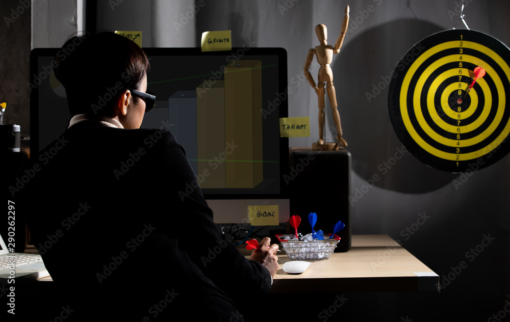 Business tomboy set dartboard as top Target and hand on computer ...