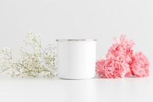 Enamel Mug Mockup With A Bouquet Of Pink Carnations And A Gypsophila On A White Table.