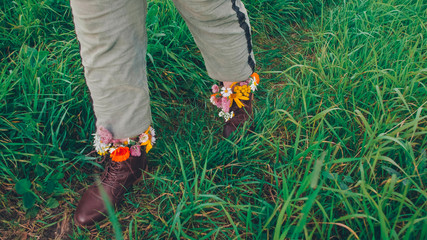 Wall Mural - flowers in boots on sunny days