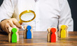 © Andrii Yalanskyi - Groups of multicolored wooden people and businessman. The concept of market segmentation. Target audience, customer care. Market group of buyers. Customer relationship management. Selective focus