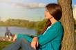 © EverGrump - Pretty pensive long haired girl resting outdoors.