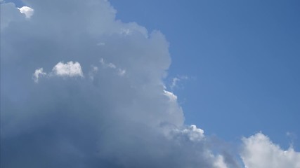 Wall Mural - time lapse of white cloud on blue sky. 4k fluffy white clouds moving during the day time