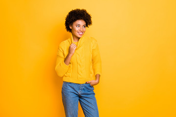 Poster - Photo of dark skin funny lady in good mood wear warm knitted pullover and jeans standing isolated yellow background