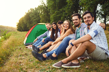 Wall Mural - A group of friends on a picnic on the nature.