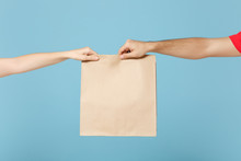 Close Up Cropped Hands Hold Brown Clear Empty Blank Craft Paper Bag Box Food For Takeaway Isolated On Blue Background. Packaging Template Mock Up. Delivery Service Concept. Copy Space Advertising Area